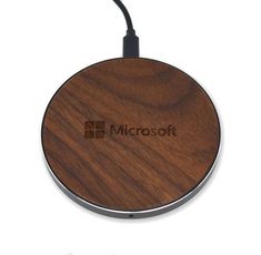 an image of a wooden surface with the microsoft logo on it's back side