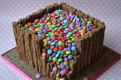 a cake with chocolate frosting and candy candies