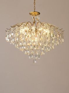 a chandelier hanging from the ceiling in a room