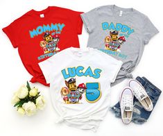 three children's t - shirts with cartoon characters on them