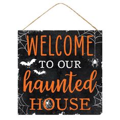 a sign that says welcome to our haunted house