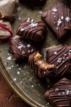 there are chocolates that have been cut in half and placed on a platter