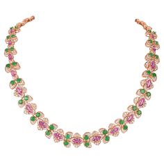 This necklace is an exquisite choker-style piece designed to sit closely around the neck, offering a touch of elegance and sophistication. The necklace features a floral motif, with a series of intricately crafted flower designs linked together. Each flower is adorned with green and white round cut diamonds, adding to the piece's brilliance. The petals of each flower are further embellished with stunning marquise cut pink sapphires, enhancing the overall visual appeal. The gemstones are set in l Chopard Necklace, Rose Gold Pendant Necklace, Diamond Choker Necklace, Diamond Choker, Pearl Cream, Family Jewellery, Choker Style, Fancy Diamonds, Modern Necklaces