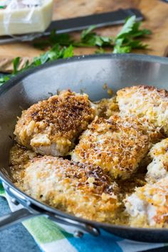 some food is cooking in a pan on the table next to butter and other items