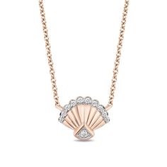 Expect smooth sailing in style with this sweet diamond necklace from the Enchanted Disney Fine Jewelry Collection inspired by Ariel. Crafted in precious 10K rose gold, this blissful design showcases a grooved shell shimmering with diamonds along the scalloped border and fan-shaped pinnacle. Captivating with 1/10 ct. t.w. of diamonds and a bright polished shine, this 0.25-inch look suspends centered along a17.75-inch cable chain that secures with a spring-ring clasp. ©Disney Ariel Necklace, Enchanted Disney, Enchanted Disney Fine Jewelry, Disney Fine Jewelry, Seashell Pendants, Scalloped Border, Smooth Sailing, Mermaid Jewelry, Disney Ariel