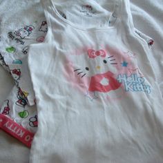 Hello Kitty Sanrio Pajamas 2 Piece Pajamas Set New Without Tags Size M Bottoms Waist Measures 14-14.5” Inches Lying Flat Not Stretched The Bottoms Are Cropped Measures 29”Inches From The Waist Band To The Bottom Hem Tank Top With Bottoms Wrinkles From Being Tucked Away In My Drawer. Never Worn From A Smoke Free Home White Pajama Party Sets For Spring, White Spring Pajama Party Sets, Playful White Sleeveless Sleepwear, Playful Sleeveless Cotton Sleepwear, Cute Fitted Sleepwear For Bedtime, Fitted Sleep Set For Spring, Fitted Sleepwear Set For Spring, Cute Sleeveless Loungewear Sets, Stretch Cotton Pajama Party Sets