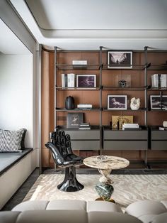 a living room filled with furniture and shelves