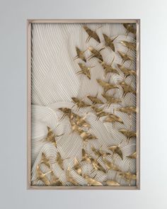 a painting with gold birds flying in the air