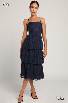 Catch their glance when you're strolling in the Lulus Grace and Beauty Navy Blue Burnout Floral Print Tiered Dress! Woven fabric, with a burnout floral jacquard design throughout, shapes this dress with adjustable spaghetti straps and a straight neckline. A darted bodice (with smocking at the back for fit) tops a banded waist and a tiered midi skirt. Hidden back zipper/clasp. Fit: This garment fits true to size. Length: Mid-calf length. Size medium measures 39" from adjustable straps to hem. Bus Dress Code Guide, Rehearsal Dinner Dresses, Tiered Midi Skirt, Jacquard Design, Adhesive Bra, Cup Sizes, Straight Neckline, Floral Jacquard, Lulu Dresses