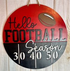 a wooden sign that says, hello football season 30 / 40 50