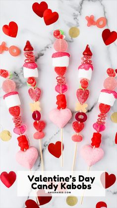 valentine's day candy kabobs on a marble table