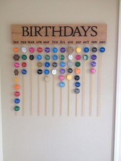 a wooden sign that says birthdays with many different colored buttons on the front of it