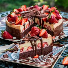 two slices of chocolate cheesecake with strawberries on the top and one slice cut out