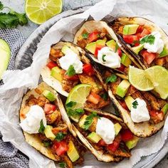 tacos with meat, tomatoes, avocado and sour cream