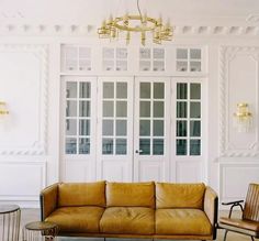 a living room filled with furniture and white walls