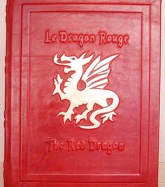 a red book with the words le dragon ruee and an image of a dragon on it