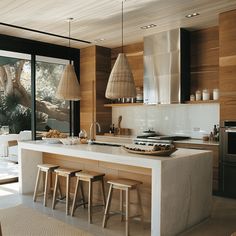 a kitchen with an island counter and stools