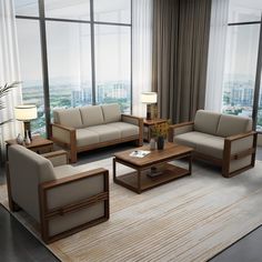 a living room filled with lots of furniture and large windows overlooking the cityscape