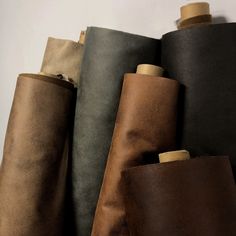 several different colored leathers are lined up together