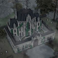 an aerial view of a large castle with green ivy growing on the roof and windows