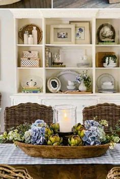 the dining room table is decorated with blue and white flowers