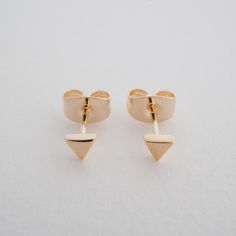 The most petite, miniature, triangle stud earrings you'll ever find. Measures 3.5 mm. Our materials make for an amazing, high quality, seamless, jewelry piece with longevity. Our earrings are plated with 18k gold, 18k rose gold, or rhodium and finished with a protective coating. A little secret we'll keep between us: it looks way more than it costs. Triangle Stud Earrings, Delicate Gold Jewelry, Diamond Huggie Earrings, Triangle Earrings Stud, Triangle Studs, Between Us, Square Earrings Studs, Square Stud, Round Stud Earrings