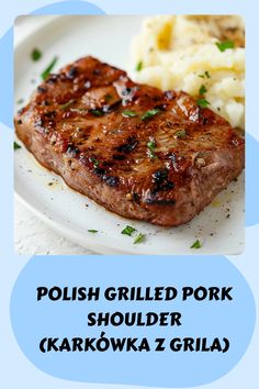 a white plate topped with meat and mashed potatoes next to a blue label that says polish grilled pork shoulder karakowka z grila