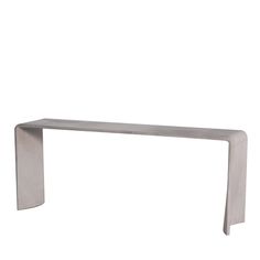 a metal bench sitting on top of a white floor