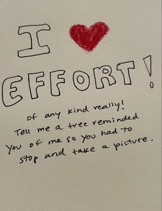 a note written to someone in front of a white wall with the words i love effort on it