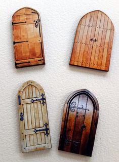 four wooden doors are mounted to the wall