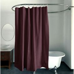 a white bath tub sitting next to a shower curtain