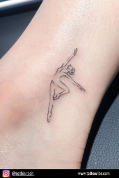 a woman's foot with a small tattoo design on the left side of her leg