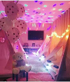 a room filled with lots of balloons and stuffed animals