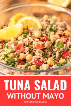 tuna salad in a glass bowl with lemons on the side and text overlay that reads tuna salad without mayo