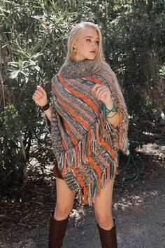 Introducing our multicolor marled knit turtle neck poncho! This cozy and warm poncho is perfect for those chilly days and nights. With its unique design, this poncho will keep you stylish and comfortable all day long. Made from a soft and comfortable fabric, this poncho is sure to become your new favorite. Whether you're out on a hike or snuggling up at home, our turtle neck poncho is the perfect accessory for any chilly day. So don't let the cold weather stop you from looking your best, order o Acrylic Poncho Shawl For Fall, Acrylic Shawl Poncho For Fall, Cozy Poncho For Cold Weather, One Size Acrylic Poncho For Fall, Bohemian Multicolor Poncho For Fall, Multicolor Bohemian Poncho For Fall, Bohemian Knitted Poncho For Fall, One Size Soft Knit Poncho For Fall, Multicolor Poncho Shawl For Winter