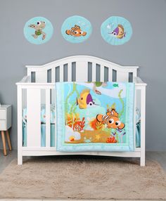 a baby crib with fish and sea animals on it