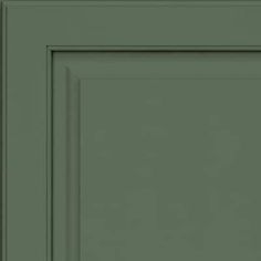 an image of a green cabinet door with the bottom panel painted in dark green color