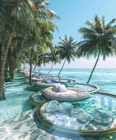 an outdoor swimming pool with lounge chairs and palm trees in the background, surrounded by clear blue water