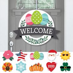 a welcome sign is hanging on the front door with lots of stickers around it