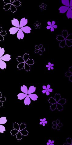 purple flowers on a black background with white outlines in the bottom right hand corner