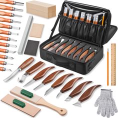 an assortment of knives and other tools in a case with the contents laid out next to it