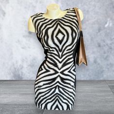 Cute Bisou Bisou Zebra Print Mini Shift Dress, Size Large (12). Perfect for the office or a night out!  Measures: Shoulder 15" in Pit 16" in Length 32" in VERY TINY stain above quarter on last picture.  Welcome to MyEZVintage! Thank you for stopping by! Enjoy looking and let us know if you need help with anything!  Pics are part of our description. Please view the ENTIRE listing carefully as we don't offer returns. If you have any questions, please ask us BEFORE purchasing. We're happy to answer you. We videotape all items being packaged and may affix a tamper-proof tag to cut before first wearing/using.  Located at MyStyle Boutique. Open Mon-Sat 10-5 at 11000 70th Ave. Seminole, FL 33772 Please Note: Due to the nature of vintage/antique items, some may exhibit slight manufacturer flaws an Mini Shift Dress, Antique Items, Dress Clothes For Women, Zebra Print, Shift Dress, Work Wear, Night Out, Dress Outfits, Women Accessories