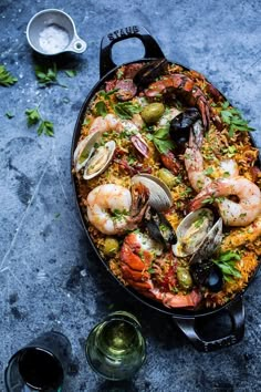 seafood paella with shrimp, mussels and wine