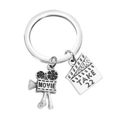 PRICES MAY VARY. ❤Movie key ring, Vintage Movie Camera keychain ❤Material and size: Alloy. Nickel free. Lead free. Hypoallergenic.Keychain length (1.37*0.98Inch) ❤Movie fans keychain,Moviemaker gift;Makes a great gift for budding filmmaker, film director, videographer,moviemaker, movie lover, producer, or film school student. ❤It would be an perfect gift for someone who works in the film industry, from actors and actresses to writers, directors, producers and anyone else working behind the scene Vintage Movie Camera, Photography Darkroom, Movie Jewelry, Film Student, Camera Keychain, Velvet Cloth, Movie Camera, Film School, Student Gift