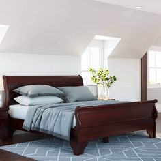 a bedroom with white walls and blue carpet