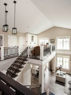 a living room filled with furniture and a staircase