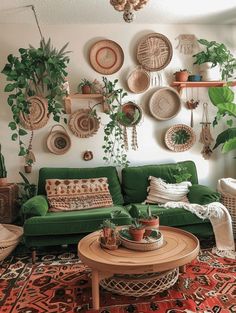 a living room filled with lots of plants and wicker baskets hanging on the wall