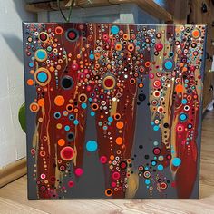 an abstract painting with circles and dots on it