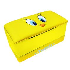 a yellow box with eyes painted on it