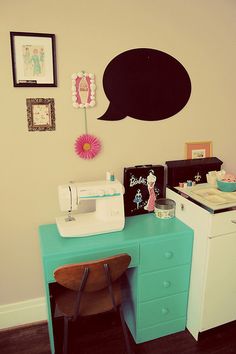 a sewing machine sitting on top of a blue desk